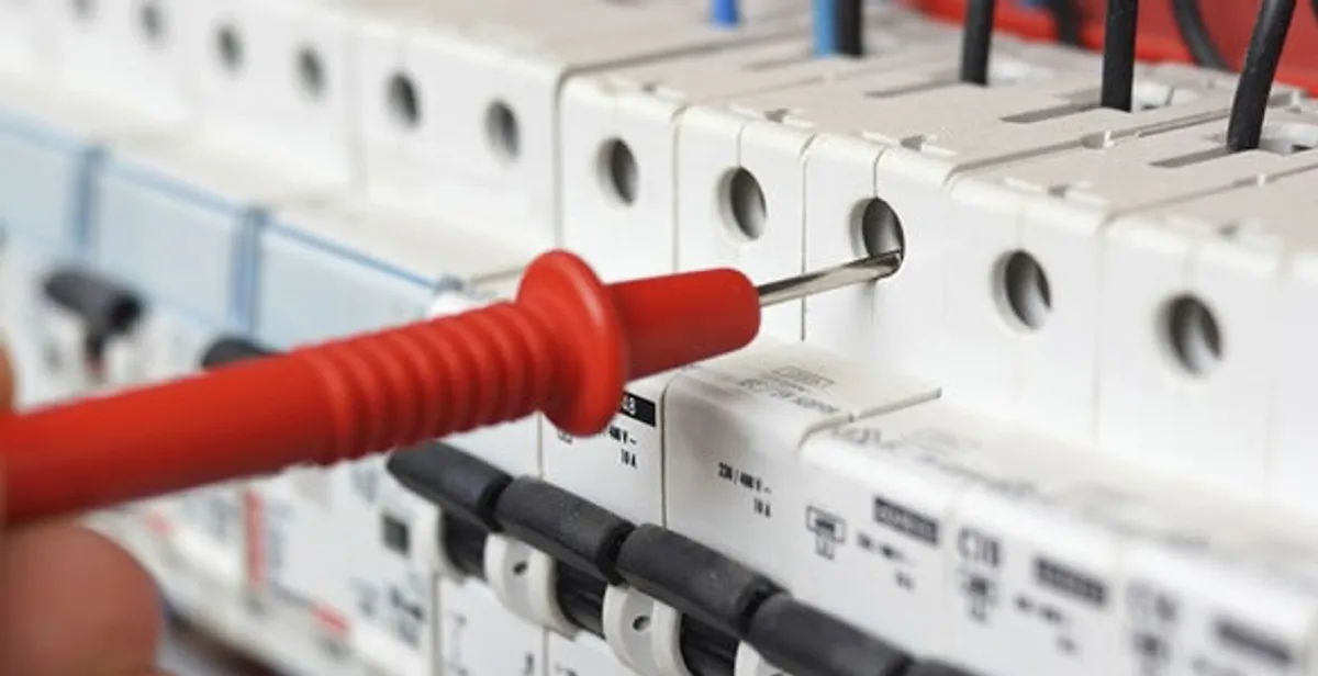 Electrical contractor testing circuit breakers during electrical repair in Haddon Heights, NJ