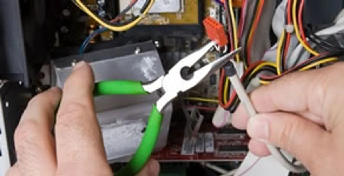 Licensed electrical contractor performing electrical repair with tools in Lawnside, NJ